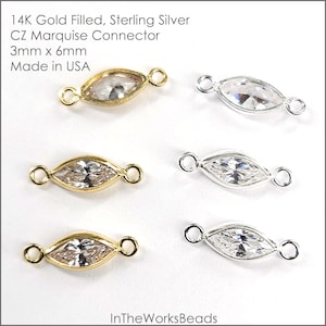 Puede incluir: Seis conectores en forma de marquesa. Tres son de oro laminado con piedras CZ transparentes y tres son de plata de ley con piedras CZ transparentes. Cada conector mide 3 mm x 6 mm. El texto de la imagen dice: 14K Gold Filled, Sterling Silver, CZ Marquise Connector, Made in USA.