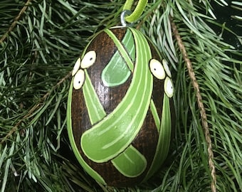 Mistletoe turned &#39;egg&#39; hanging decoration.