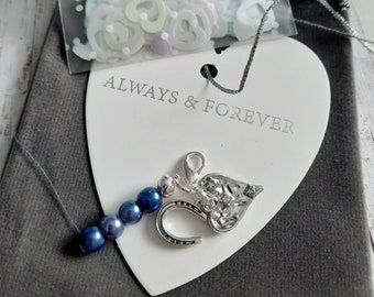 Something blue clip on blue bead, heart, horseshoe charms and gift bag