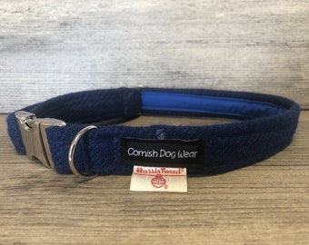 May include: A blue tweed dog collar with a silver buckle and a label that reads "Cornish Dog Wear" and "Harris Tweed".