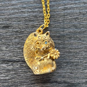 Rare Vintage Max Factor solid perfume raccoon charm necklace