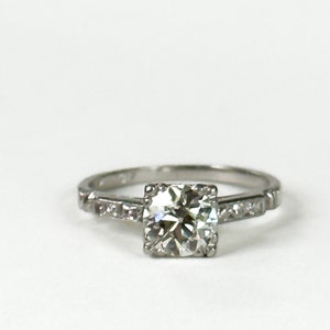 Art Deco Round Diamond and Platinum Engagement Ring With Square Setting