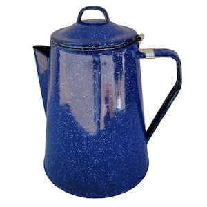 May include: A blue enamel coffee pot with a speckled finish and a lid with a handle. The pot has a spout and a handle.