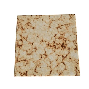 May include: A square ceramic plate with a brown and white marbled design.