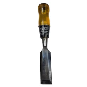 May include: A Stanley Professional wood chisel with a clear yellow handle and a silver blade. The chisel has a black band with white text near the handle. The blade is rectangular and has a beveled edge.