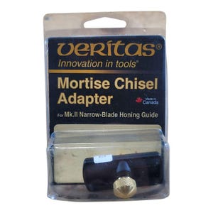 May include: A Veritas Mortise Chisel Adapter for Mk.II Narrow-Blade Honing Guide, packaged in clear plastic. The product is black with a gold-colored adjustment knob. The packaging includes the text "Innovation in tools" and "Made in Canada."