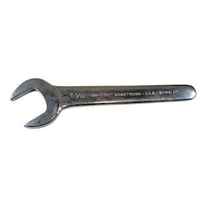 May include: A silver open-end wrench with the size 1 1/8 stamped on it. The wrench is marked with "20-036 - ARMSTRONG - USA - ARVADA". The tool is designed for tightening or loosening nuts and bolts.