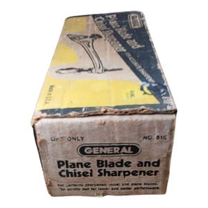 May include: Vintage General Plane Blade and Chisel Sharpener box. The box is tan and yellow with black text and a diagram of the tool. The text reads "Plane Blade and Chisel Sharpener".