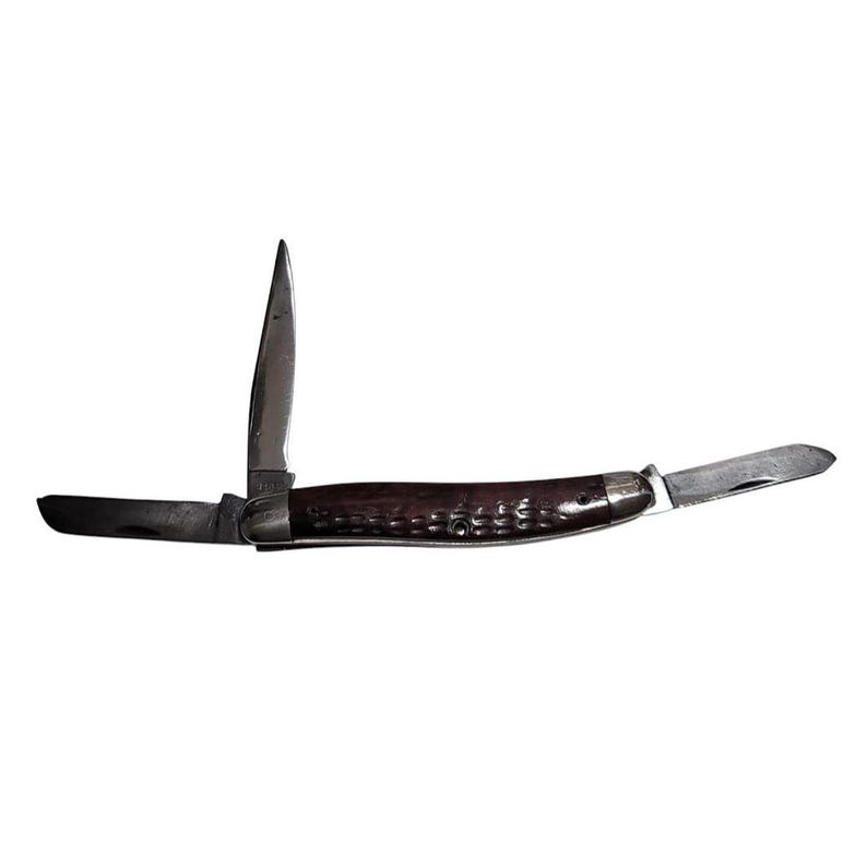 May include: A brown handled pocket knife with three blades. The knife is open and the blade is visible.