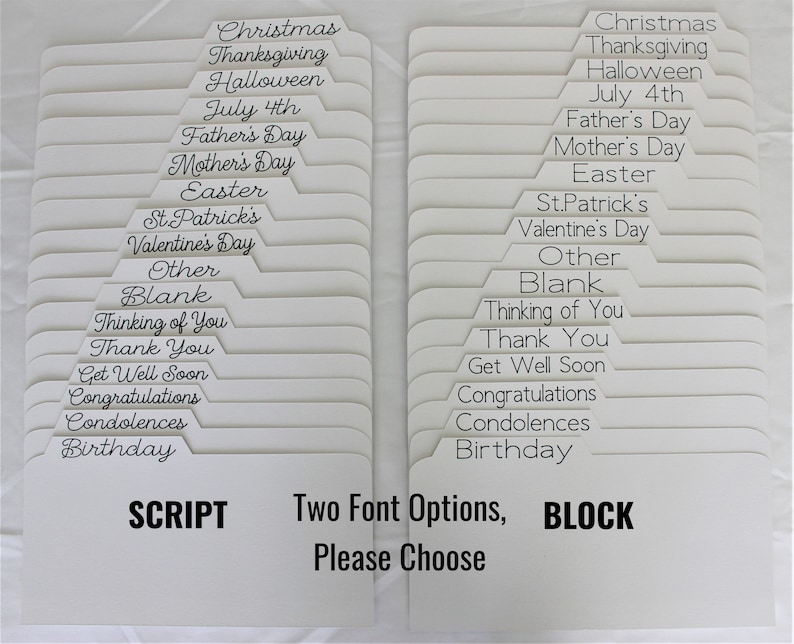 May include: Two sets of white cardstock dividers with labels for various occasions, including holidays and sentiments. One set features script font, the other block font. Text includes "Christmas," "Thanksgiving," and "Birthday." The image text reads "Two Font Options, Please Choose."