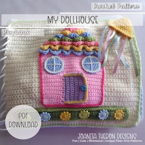 May include: A crochet dollhouse playset with a pink house, a green roof, and a yellow sun. The house has a purple door and blue windows. The playset includes a white crocheted background and a green and yellow border.