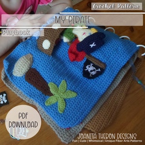 May include: A blue crocheted play mat with a pirate theme. The mat features a pirate ship, a treasure chest, a palm tree, and a skull and crossbones. The mat is designed for children to play with and learn about pirates.