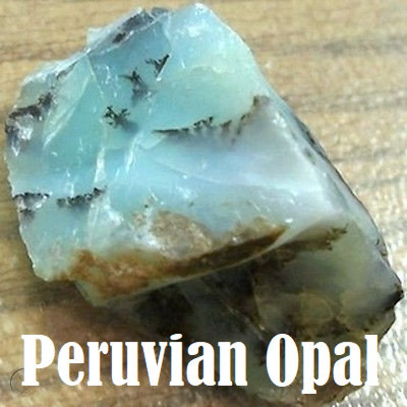 May include: A rough, light blue Peruvian opal with dark gray and brown markings.