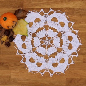 Spooky Decor: Crochet Doily Adorned with Skulls