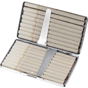 May include: A silver cigarette case with a metal slide to push cigarettes out. The case is open and filled with white cigarettes.