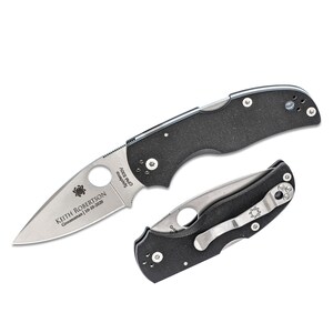 May include: Two black folding knives with silver blades are displayed. One is open, the other closed. The open knife has text that reads "KEITH ROBERTSON Groomsman 10-10-2020". The blades have a Spyderco logo and text. The handles are textured.