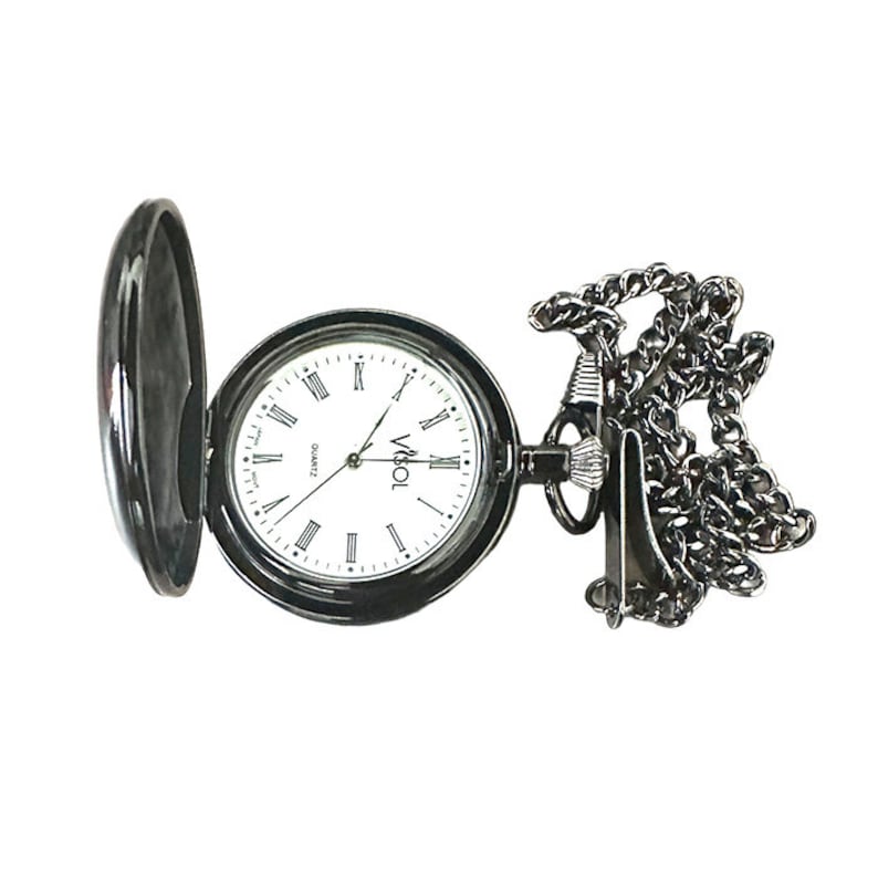 May include: A black pocket watch with a white face and Roman numeral hour markers. The watch has a chain attached to it.
