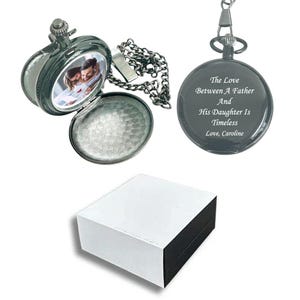 May include: A silver pocket watch with a photo of a couple inside. The back of the watch is engraved with the message "The Love Between A Father And His Daughter Is Timeless. Love, Caroline."