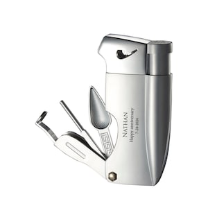 May include: Silver multi-tool lighter with a built-in poker, tamper, and spoon. The lighter has a personalized inscription that reads "NATHAN Happy anniversary 7-24-2004".