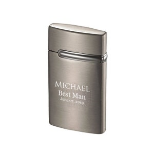 May include: A brushed metal lighter with the engraved text "MICHAEL Best Man June 07, 2019". The lighter has a rectangular shape with rounded edges and a silver accent.