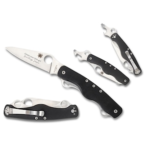 May include: A collection of folding knives and bottle openers. The knives have silver blades and black handles. One knife blade has the text "Always your little girl, love always, Jessica" and a spider logo. The bottle openers are black and silver.