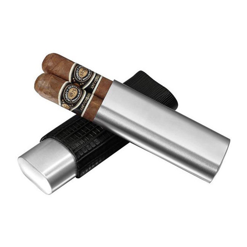 May include: A silver cigar tube with a black leather sleeve. The tube is open and two cigars are inside. The cigars are labeled "1897 Anniversary"