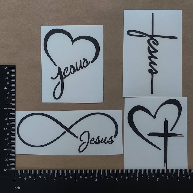May include: Four black vinyl decals with different designs featuring the word "Jesus". The designs include a heart, a cross, an infinity symbol, and a heart with a cross.