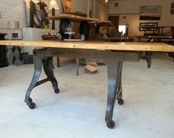 Vintage industrial cast iron machine base dining table