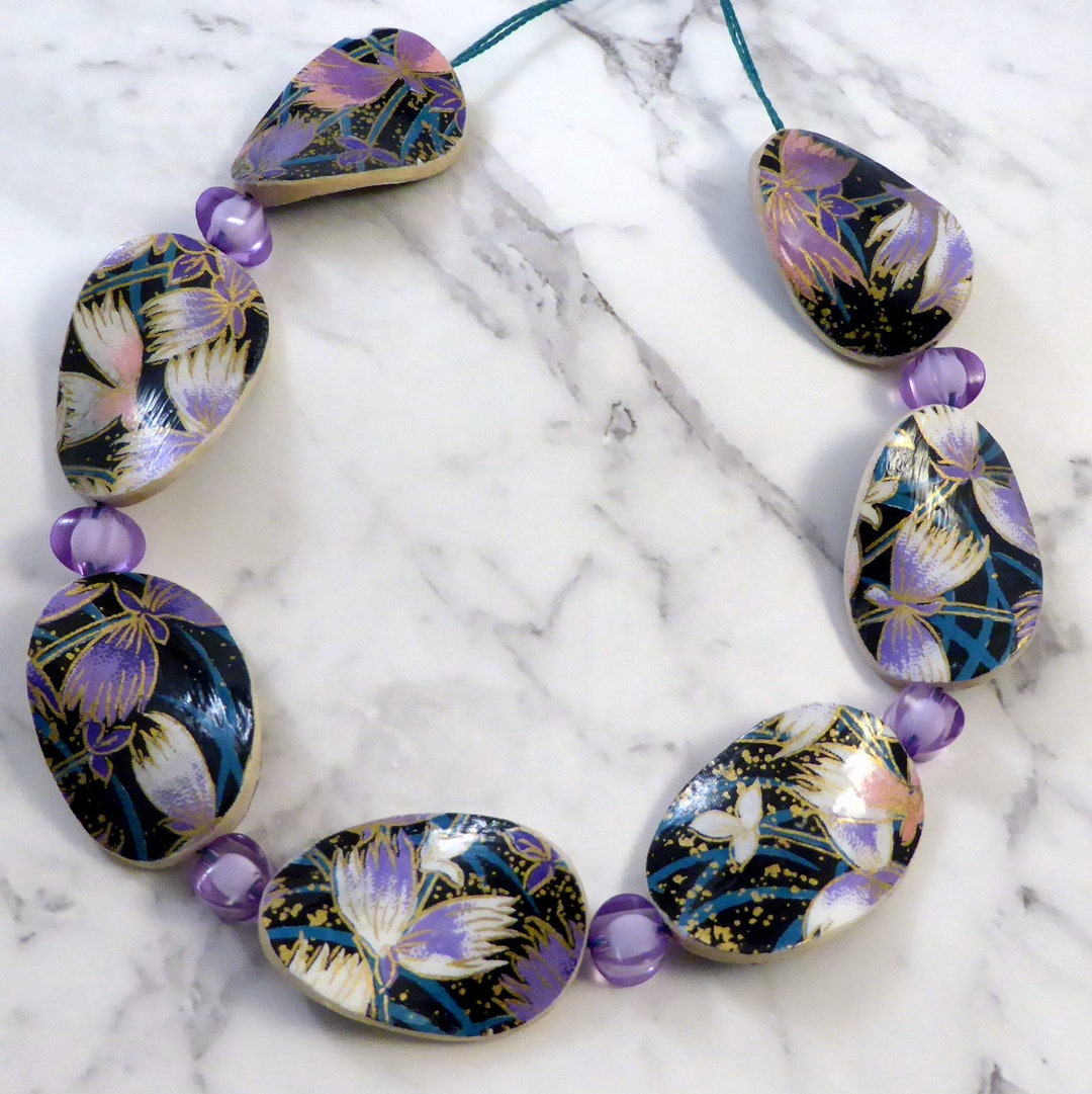 Japanese paper wooden beaded necklace in black, purple, and teal floral pattern