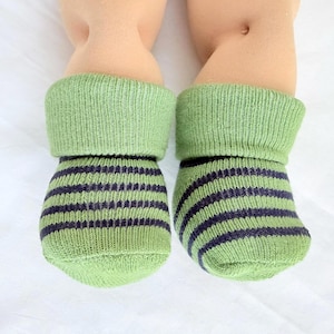 May include: A rustic wooden sign with the text "Welcome to our home" in white lettering. The sign features a distressed finish and a simple, inviting design, perfect for entryway decor.