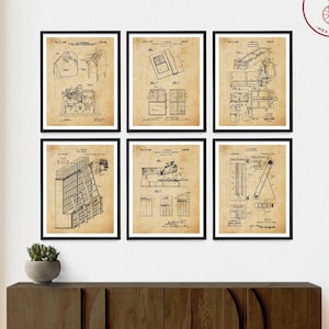 May include: Six vintage patent drawings in black and white, framed in black, are displayed on a wall above a dark brown wooden cabinet. The drawings are for various inventions, including a folding chair, a folding table, and a folding bed.