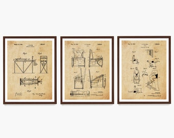May include: Three vintage patent drawings in brown frames on a white background. The drawings are for a "Vibrating Exerciser", a "Chair for Exercising", and a "Device for Exercising the Legs".
