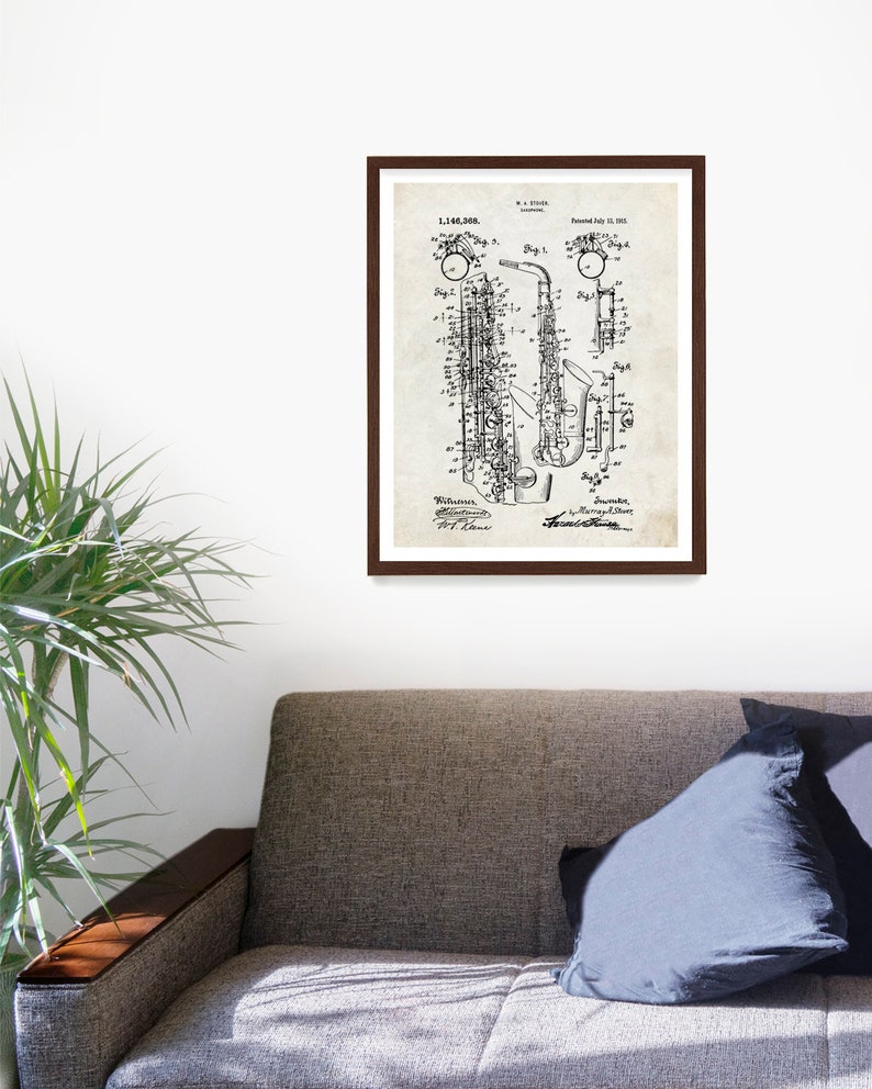 May include: Black and white vintage patent drawing of a saxophone. The patent number is 1,146,508 and the date is July 11, 1915. The drawing shows the saxophone in detail, including the keys, the bell, and the mouthpiece.