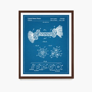 May include: A blue and white patent drawing for a dog chew toy. The drawing shows a rope toy with a knot in the middle. The patent number is 5,215,038 and the date of the patent is June 1, 1993.