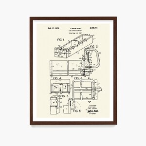 May include: A framed print of a card catalog drawer patent illustration. The black and white drawing includes multiple views and technical details, with text indicating the filing date of Feb. 17, 1970, and the names J. Risom et al.