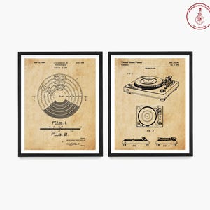 May include: Two vintage black framed prints of a record player patent. The left print shows a diagram of a record player with the text "Fig. 1" and "Fig. 2". The right print shows a drawing of a record player with the text "Fig. 1", "Fig. 2", "Fig. 4", and "Fig. 5".