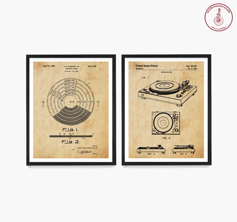May include: Two vintage black framed prints of a record player patent. The left print shows a diagram of a record player with the text "Fig. 1" and "Fig. 2". The right print shows a drawing of a record player with the text "Fig. 1", "Fig. 2", "Fig. 4", and "Fig. 5".