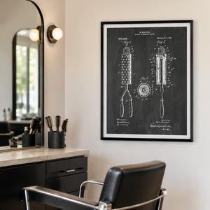 May include: A framed black and white patent print on a wall, displaying technical diagrams of a hair curling iron labelled M. BISSICKS, DRESS CURLING IRON, 900,286, Patented Oct 6, 1908, featuring three distinct figures showing the tool's components.