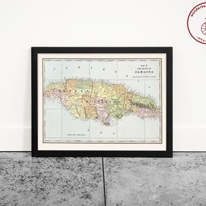 May include: A vintage map of the island of Jamaica, printed in color with a black frame. The map shows the island's parishes and includes the title "Map of the Island of Jamaica".