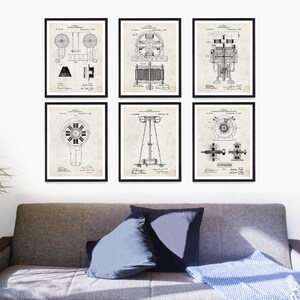 May include: Set of six black and white vintage electrical motor patent prints. The prints are framed and displayed on a white wall above a gray couch.