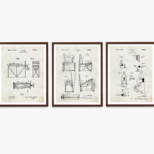 May include: Set of three vintage patent prints in black and white, framed in brown wood. The prints depict different exercise machines, including a rowing machine, a chair with a footrest, and a device for stretching the legs.