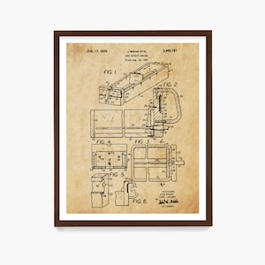 May include: A framed vintage patent print of a card catalog drawer, dated February 17, 1970. The print features detailed technical drawings with labels and figures, in black ink on a tan background. The frame is dark brown.