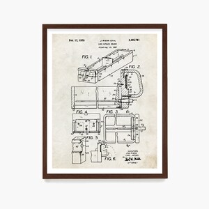 May include: A framed vintage patent print of a card catalog drawer, dated February 17, 1970. The black and white technical drawing includes multiple detailed diagrams and the names J. Risom et al. The print is in a dark brown frame.