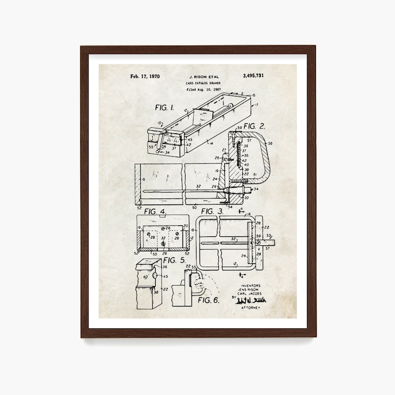 May include: A framed vintage patent print of a card catalog drawer, dated February 17, 1970. The black and white technical drawing includes multiple detailed diagrams and the names J. Risom et al. The print is in a dark brown frame.