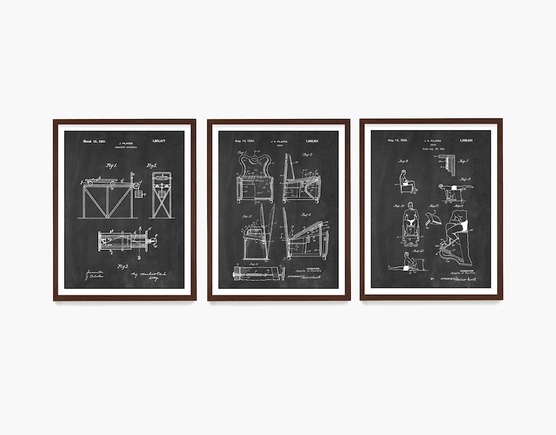 May include: Three black and white patent drawings in brown frames. The drawings depict different exercise machines. The first drawing shows a machine for exercising the arms and legs. The second drawing shows a machine for exercising the back and shoulders. The third drawing shows a machine for exercising the legs and feet.