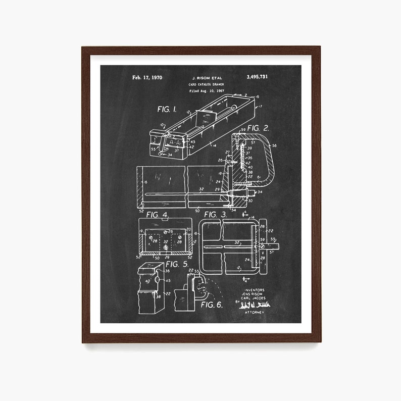May include: A framed black and white patent print of a card catalog drawer, dated February 17, 1970. The print includes detailed diagrams and technical drawings of the drawer's components, with labels and figures.