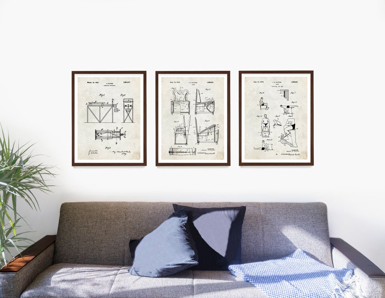 May include: Three framed vintage patent drawings of exercise equipment. The drawings are in black and white and show different types of exercise equipment, including a rowing machine, a weight machine, and a stationary bike. The drawings are on a white background and are framed in brown frames.