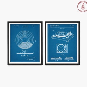 May include: Two blue and white vintage patent prints for a record player. The first print shows a diagram of a record player turntable. The second print shows a diagram of a record player with a tone arm and needle.
