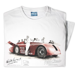 May include: White t-shirt with a red and black illustration of a vintage race car, a group of people standing around the car, and the text "1000 HP CAR BUILT BY WOLVERHAMPTON ENGLAND". The text "Sunbeam Restoration Campaign Collaboration" is at the bottom of the shirt.