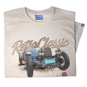 May include: A beige t-shirt with a vintage blue car graphic and the text "Retro Classic" in a gold script font. The car has a white steering wheel and the word "MALTA" on the license plate.